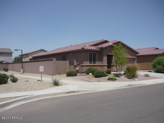 7342 West Darrel Road Laveen, AZ 85339 - Photo 2 of 3 exterior west exposure-green belt