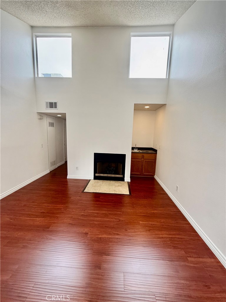 10700 Colima Road, Unit 914 Whittier, CA 90604 - Photo 3 of 14 a view of empty room with wooden floor
