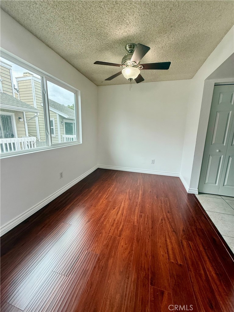 10700 Colima Road, Unit 914 Whittier, CA 90604 - Photo 4 of 14 a view of empty room with wooden floor and fan
