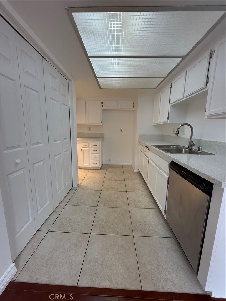 10700 Colima Road, Unit 914 Whittier, CA 90604 - Photo 5 of 14 a kitchen with a sink and cabinets