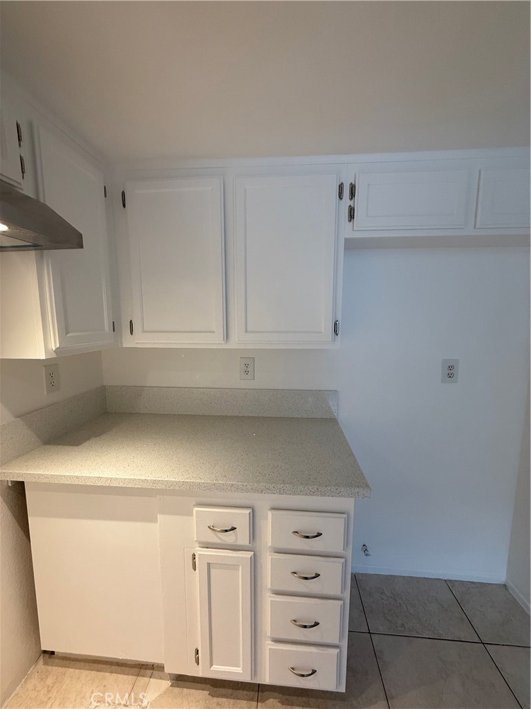 10700 Colima Road, Unit 914 Whittier, CA 90604 - Photo 6 of 14 a view of cabinets and utility room with closet
