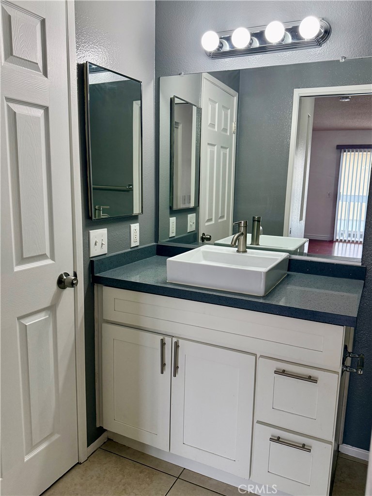 10700 Colima Road, Unit 914 Whittier, CA 90604 - Photo 9 of 14 a bathroom with a sink and a mirror