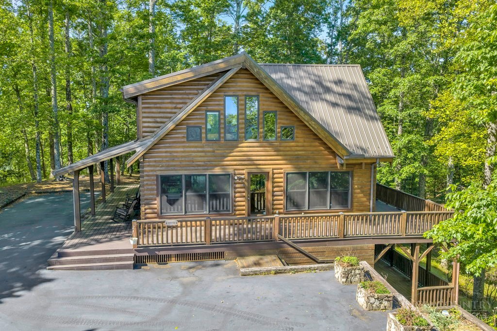 2229 Elk Ridge Road Ferguson, NC 28624 - Photo 3 of 42 a front view of a house with a yard
