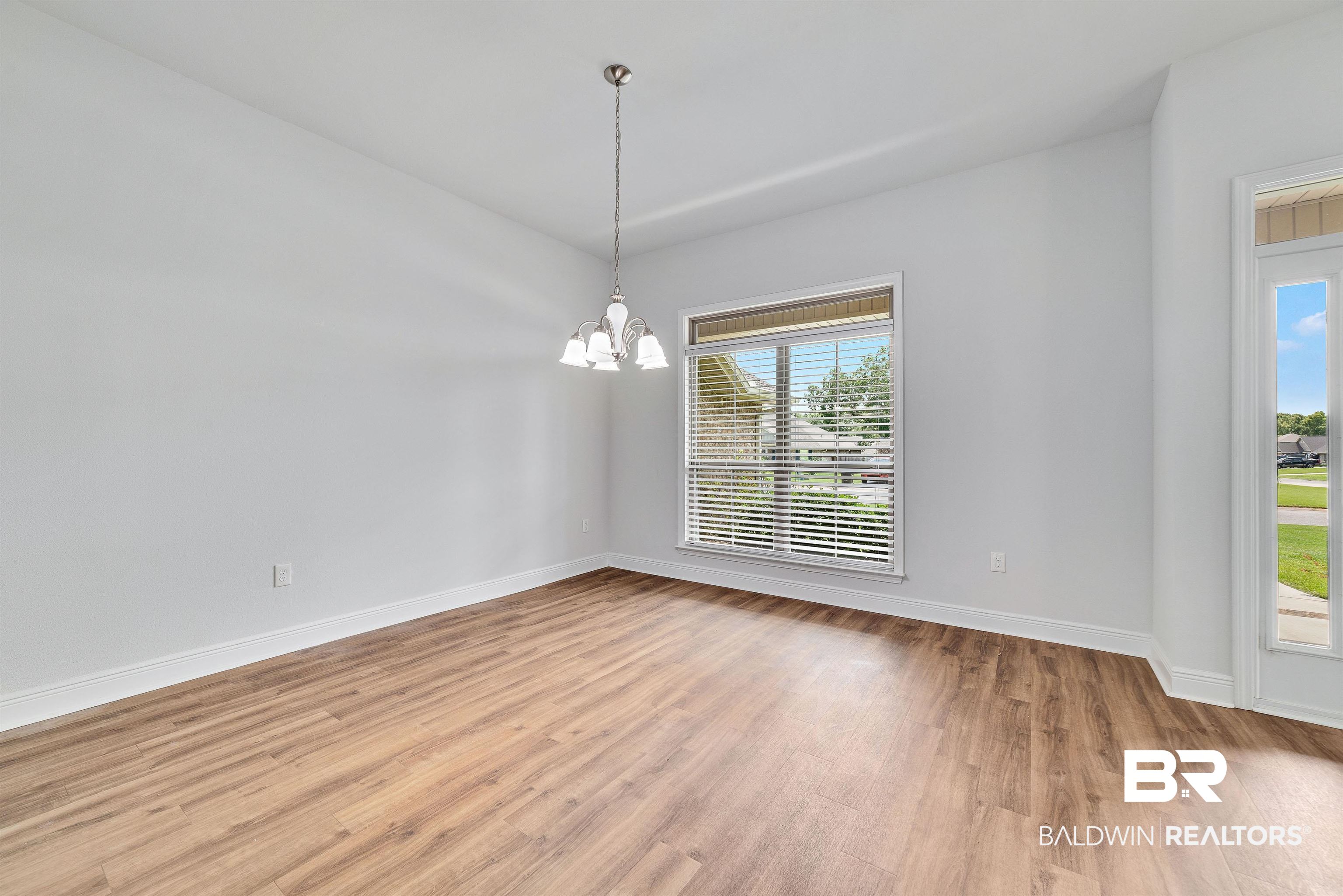13155 Wishbone Court Foley, AL 36535 - Photo 9 of 39 Interior space featuring a chandelier and hardwood / wood-style floors