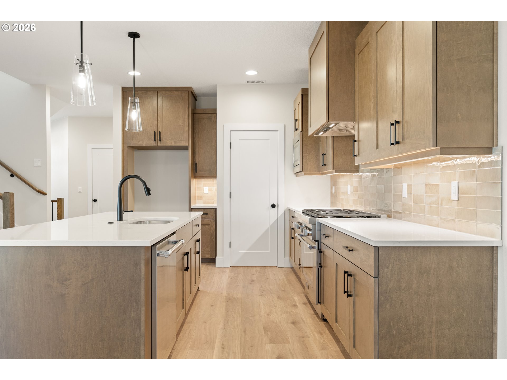 2947 Northwest 114th Terrace Portland, OR 97229 - Photo 11 of 46 a kitchen with a sink stove and refrigerator