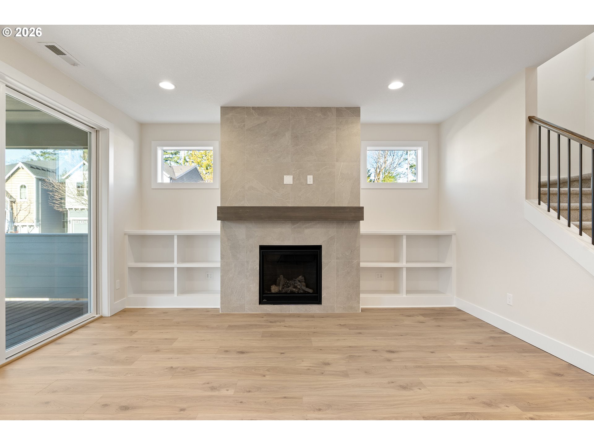 2947 Northwest 114th Terrace Portland, OR 97229 - Photo 17 of 46 a view of an empty room with wooden floor and a window