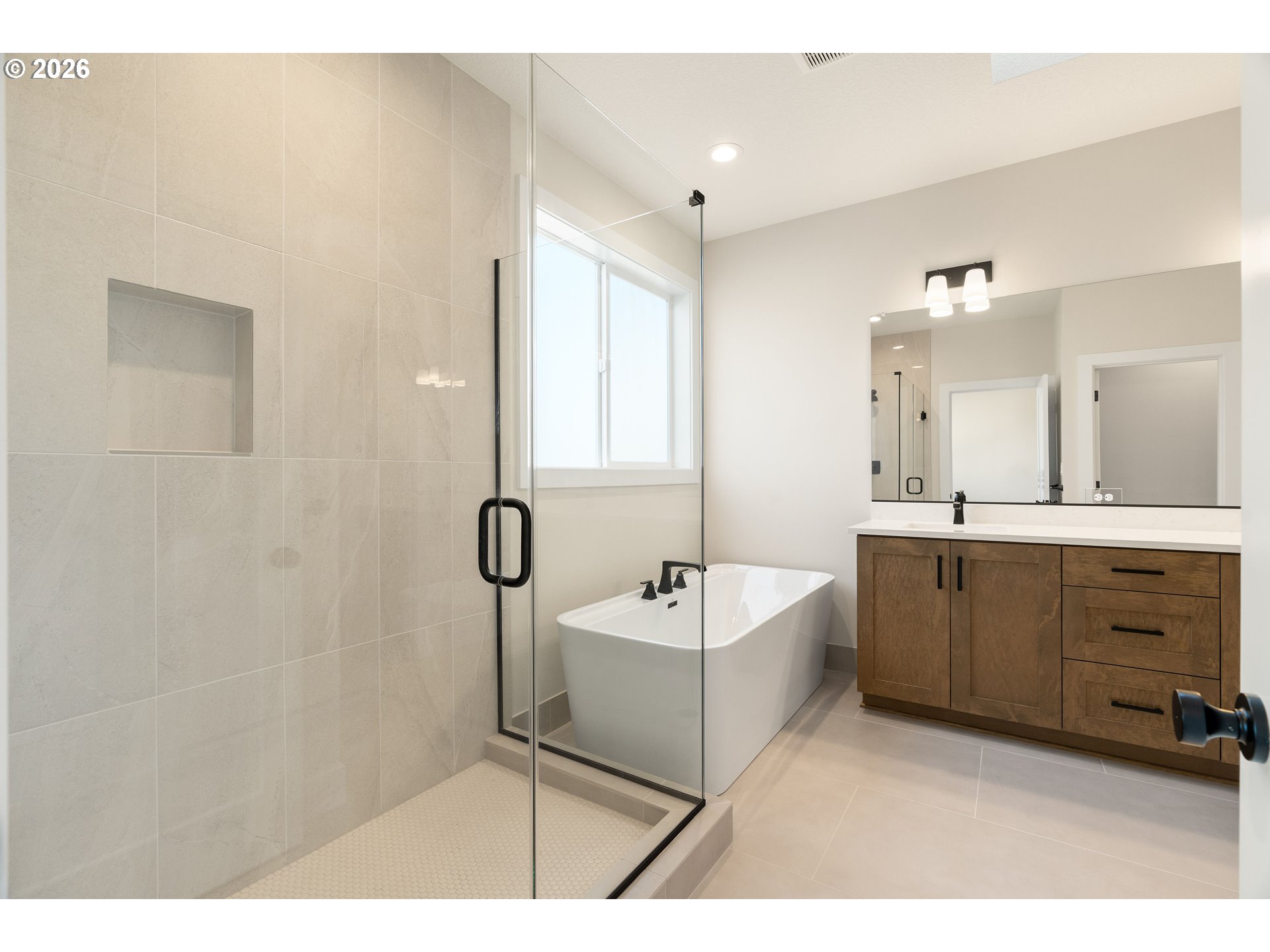 2947 Northwest 114th Terrace Portland, OR 97229 - Photo 23 of 46 a spacious bathroom with a double vanity sink mirror and bathtub