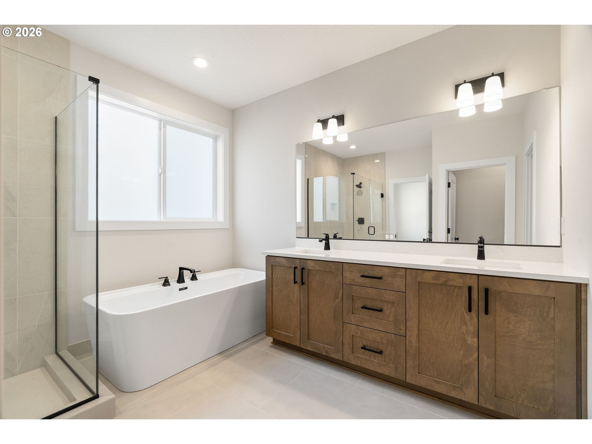 2947 Northwest 114th Terrace Portland, OR 97229 - Photo 24 of 46 a bath room with a sink a mirror and a bathtub