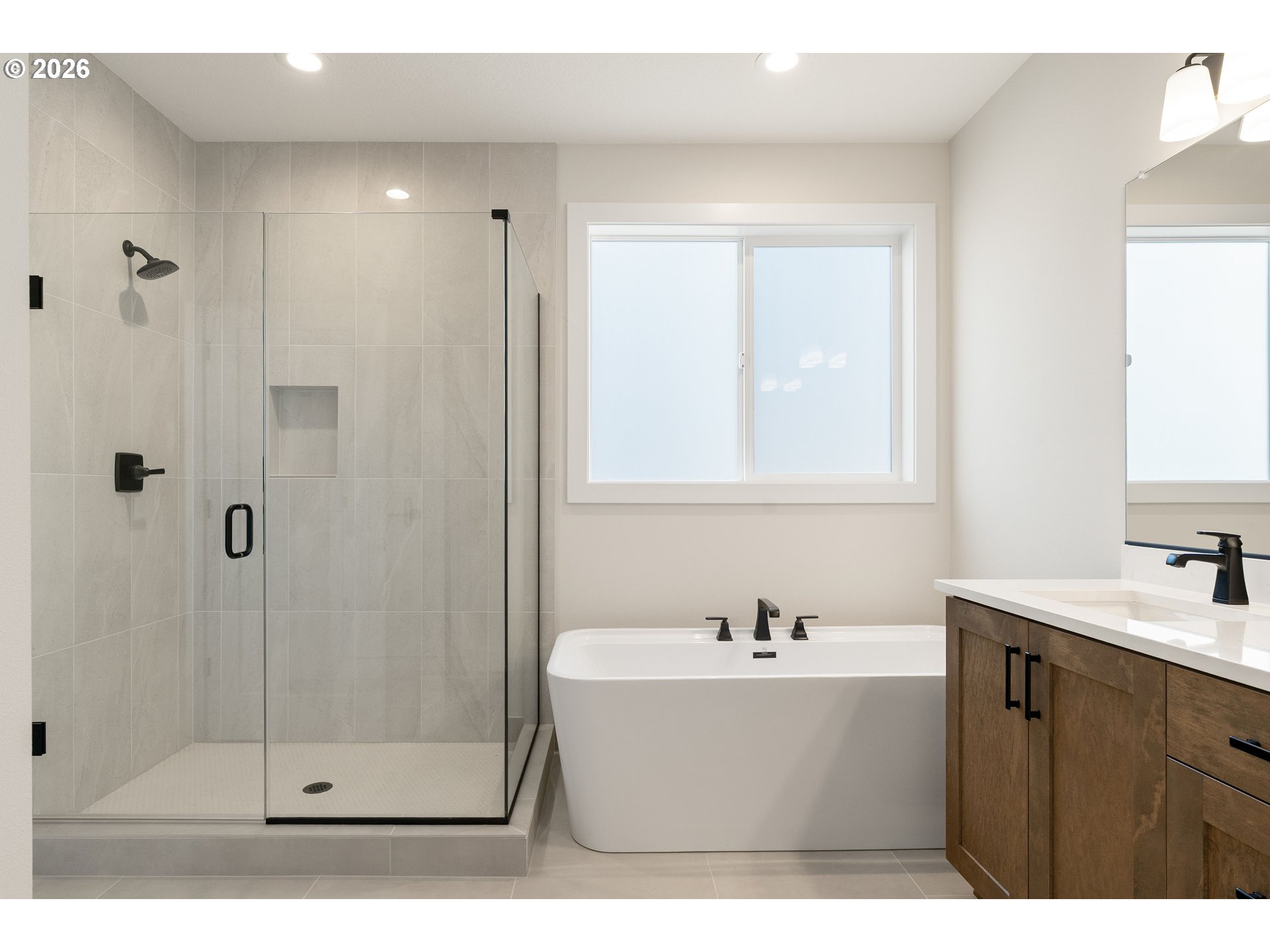 2947 Northwest 114th Terrace Portland, OR 97229 - Photo 25 of 46 a white bath tub sitting next to a bathroom sink