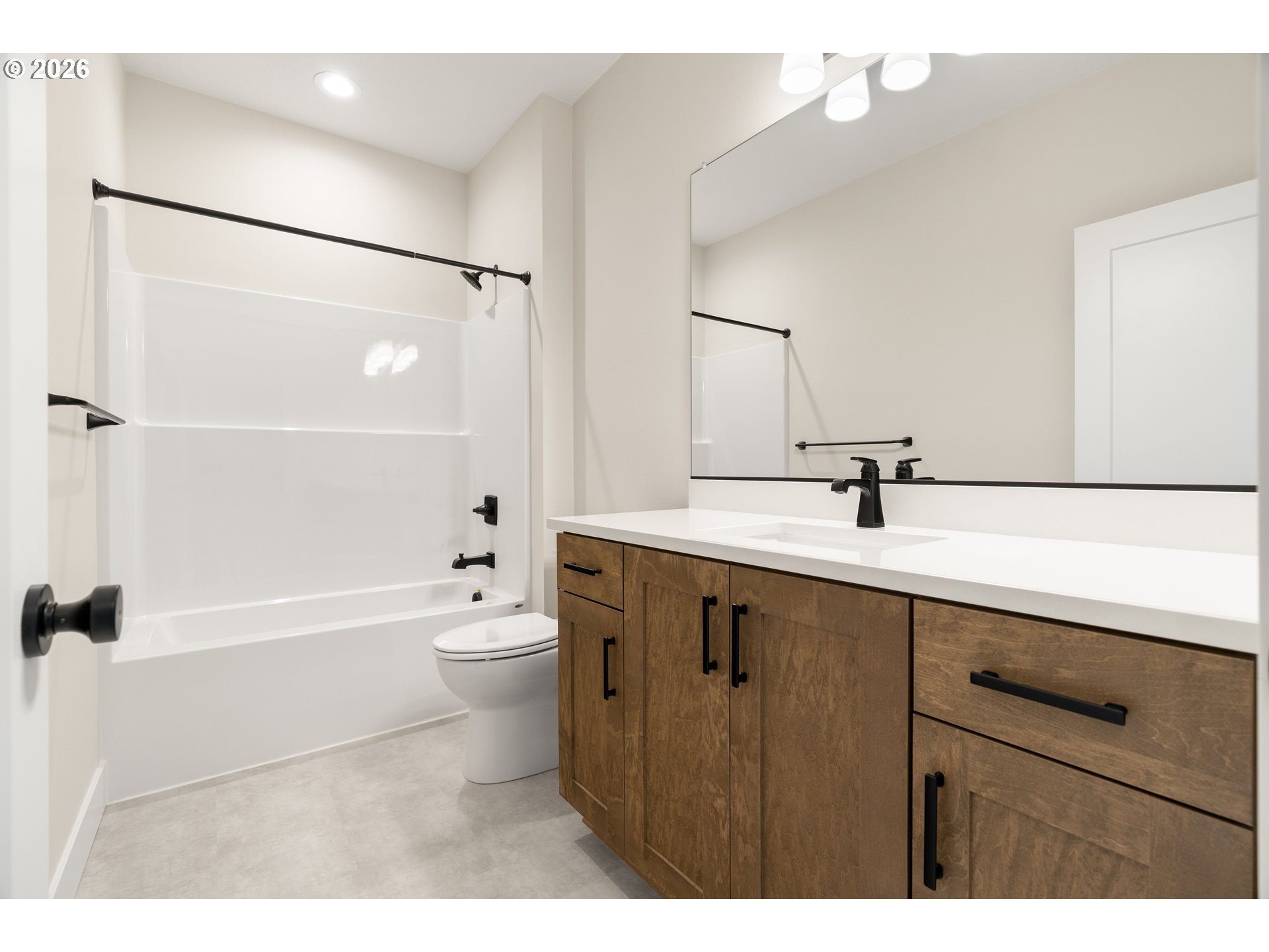 2947 Northwest 114th Terrace Portland, OR 97229 - Photo 34 of 46 a bathroom with a double vanity sink toilet mirror and shower