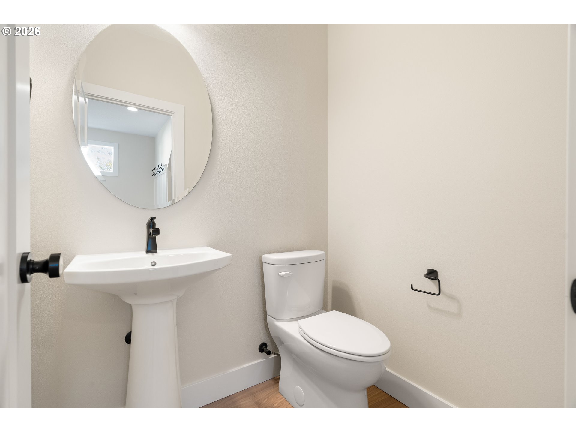 2947 Northwest 114th Terrace Portland, OR 97229 - Photo 5 of 46 a bathroom with a toilet a sink and mirror
