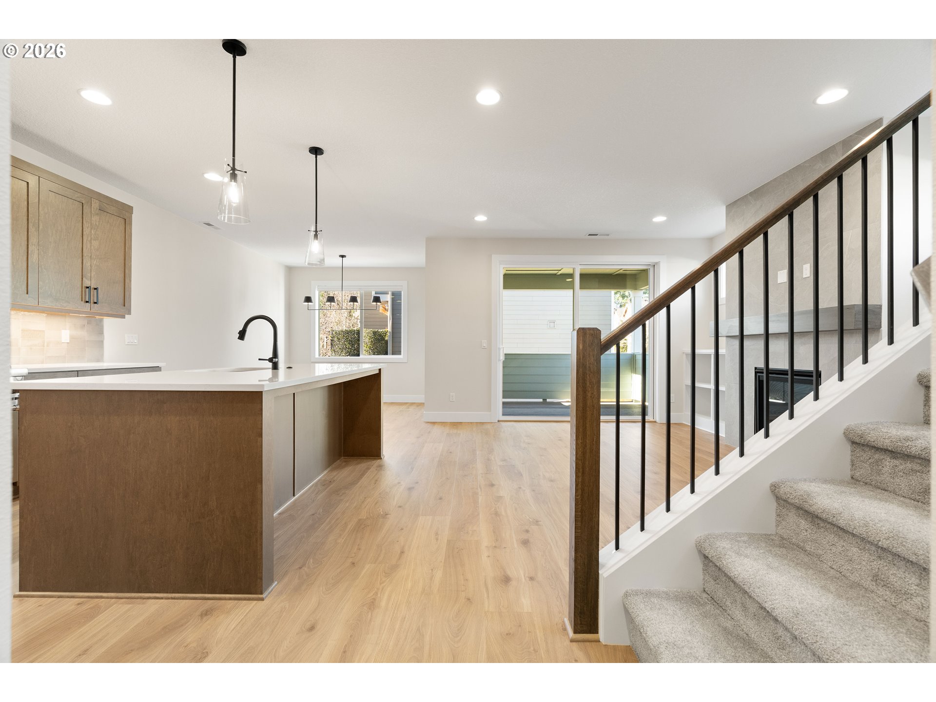 2947 Northwest 114th Terrace Portland, OR 97229 - Photo 6 of 46 a view of a kitchen with kitchen island a sink stainless steel appliances and cabinets