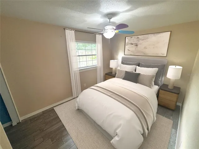 a bedroom with a bed and a window