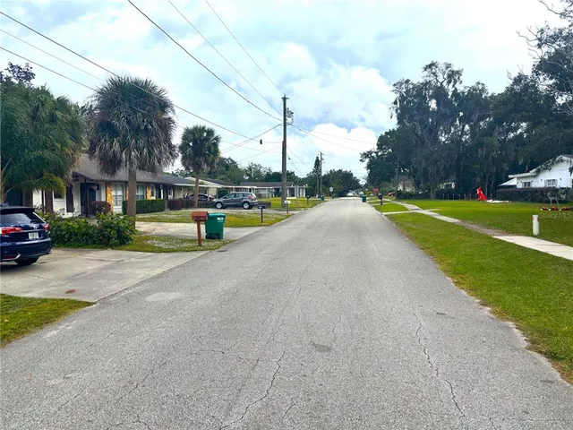 a view of a street with houses