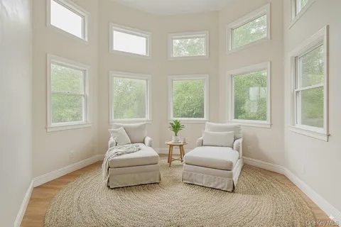 a living room with furniture and windows