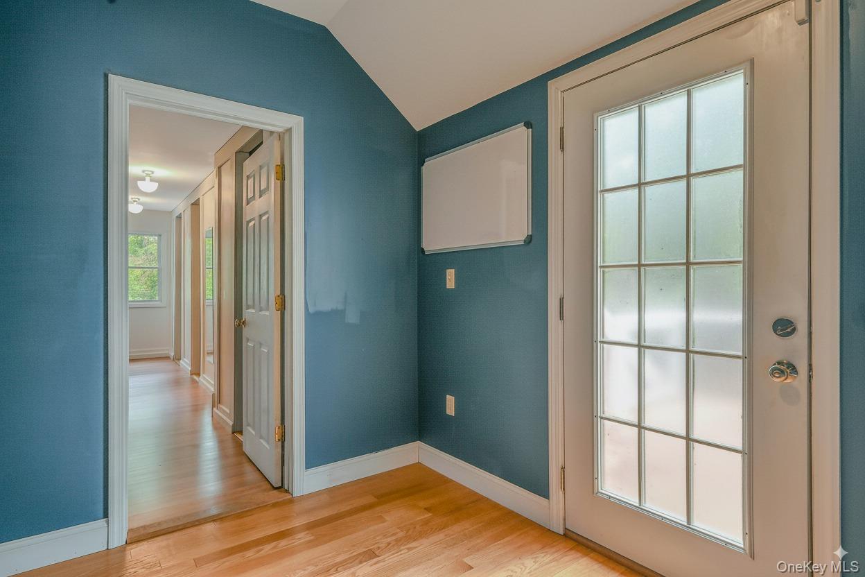 4 Skunk Hollow Road Huntington, NY 11743 - Photo 18 of 35 a view of empty room with wooden floor and fan