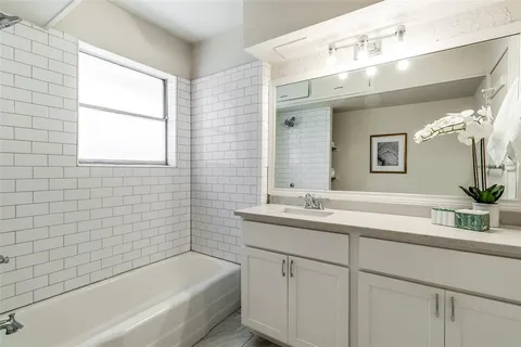 a bathroom with a sink and a bathtub