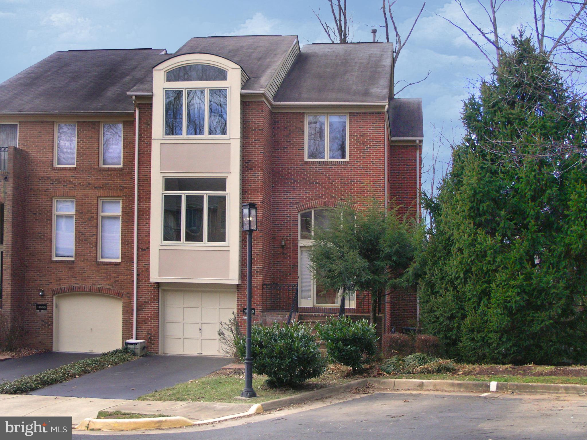 11555 Hemingway Drive Reston, VA 20194 - Photo 1 of 26 a front view of house with yard