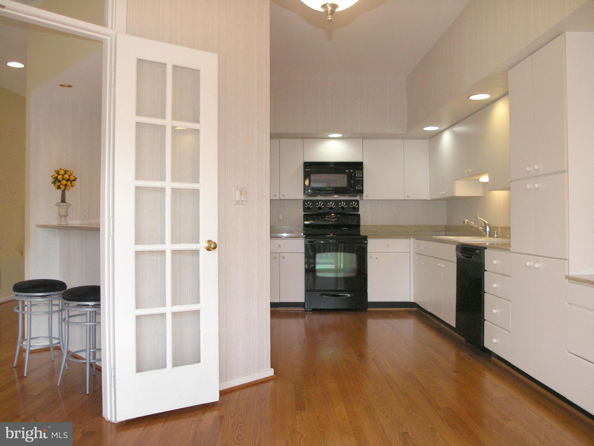 11555 Hemingway Drive Reston, VA 20194 - Photo 13 of 26 a kitchen with stainless steel appliances a refrigerator and a stove top oven