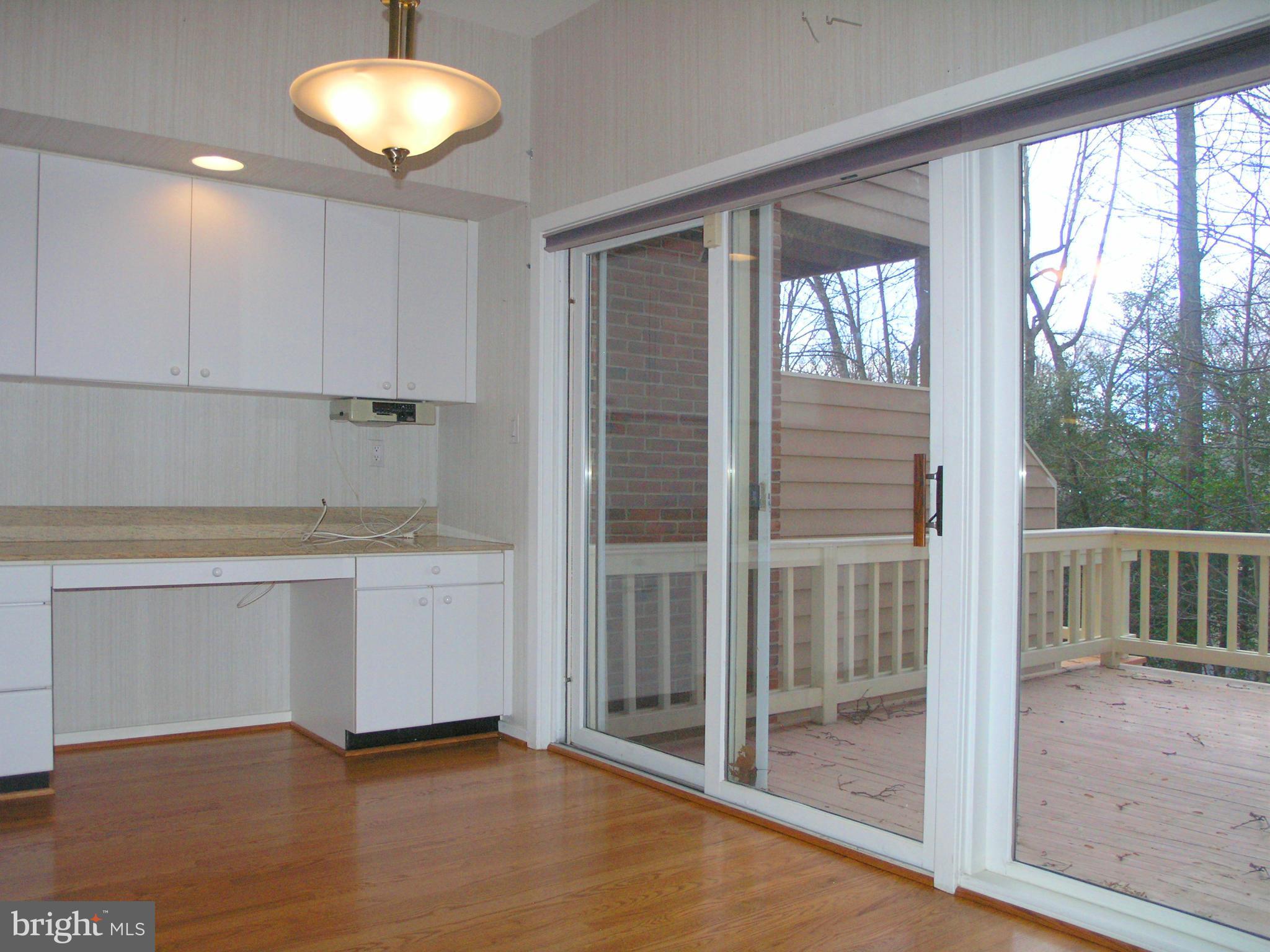 11555 Hemingway Drive Reston, VA 20194 - Photo 14 of 26 a view of an empty room with a fireplace and a window