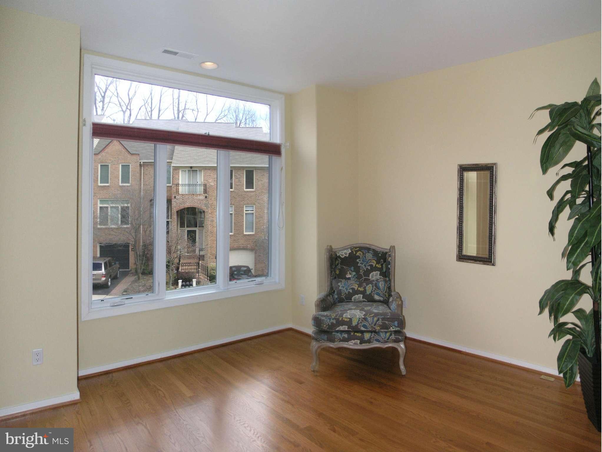 11555 Hemingway Drive Reston, VA 20194 - Photo 4 of 26 a living room with furniture and a large window