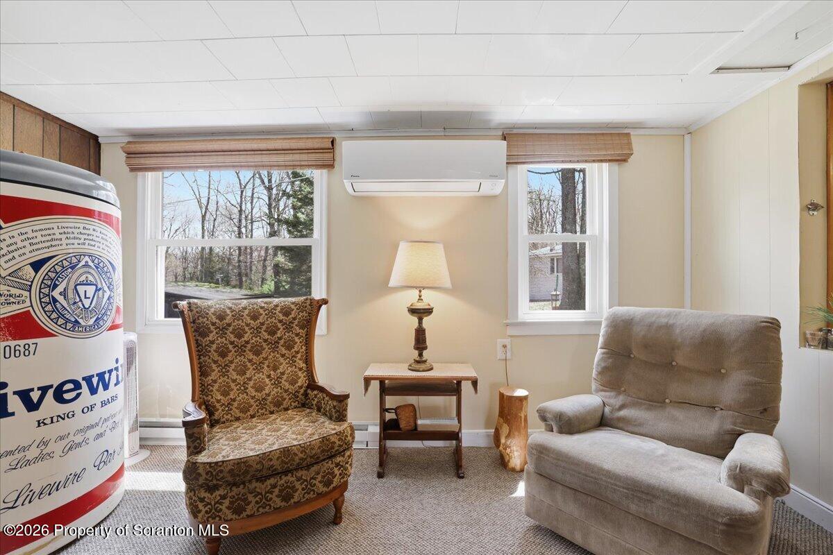 113 Stoney Hill Road Dingmans Ferry, PA 18328 - Photo 13 of 65 a living room with furniture and a window