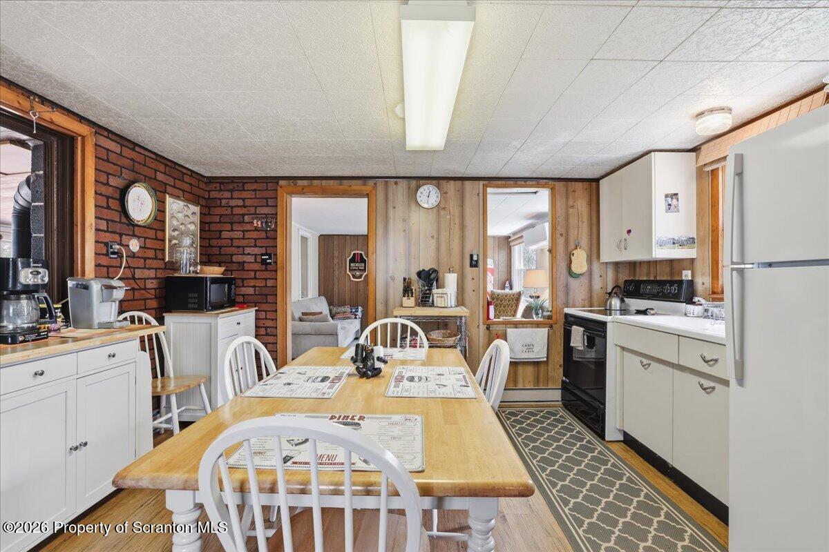 113 Stoney Hill Road Dingmans Ferry, PA 18328 - Photo 15 of 65 a very nice looking open dining room with a large window and kitchen view