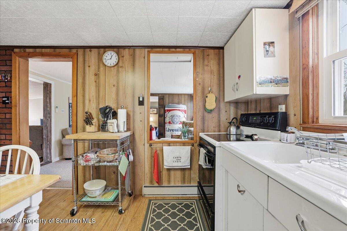 113 Stoney Hill Road Dingmans Ferry, PA 18328 - Photo 19 of 65 a kitchen with a sink and a stove top oven