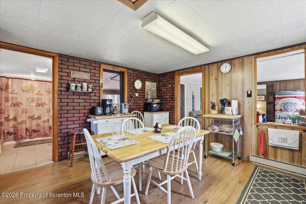113 Stoney Hill Road Dingmans Ferry, PA 18328 - Photo 20 of 65 a view of a dining room with furniture window and outside view