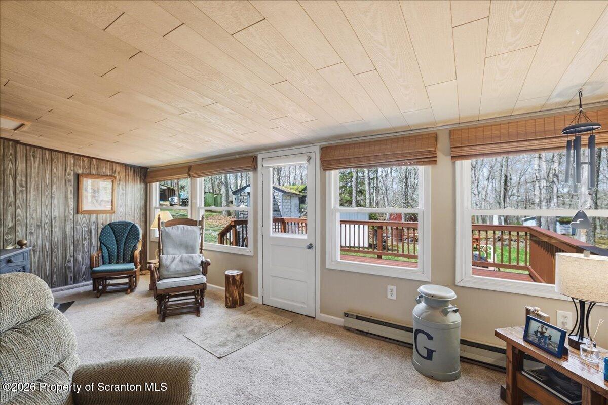 113 Stoney Hill Road Dingmans Ferry, PA 18328 - Photo 23 of 65 a living room with furniture and a large window