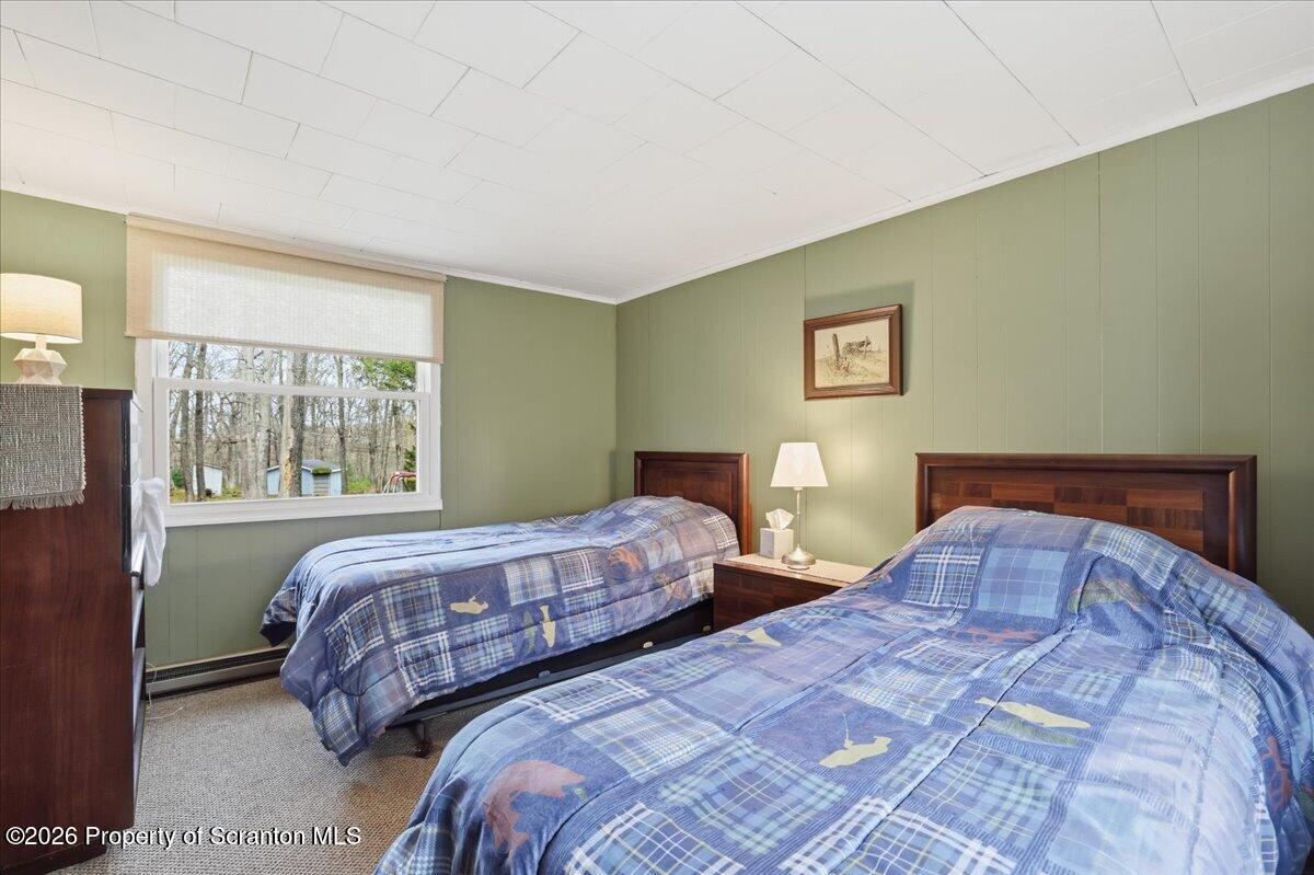 113 Stoney Hill Road Dingmans Ferry, PA 18328 - Photo 29 of 65 a bedroom with two beds and a large window