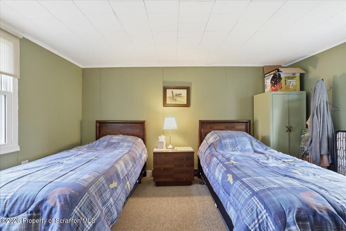113 Stoney Hill Road Dingmans Ferry, PA 18328 - Photo 30 of 65 a bedroom with bed and window
