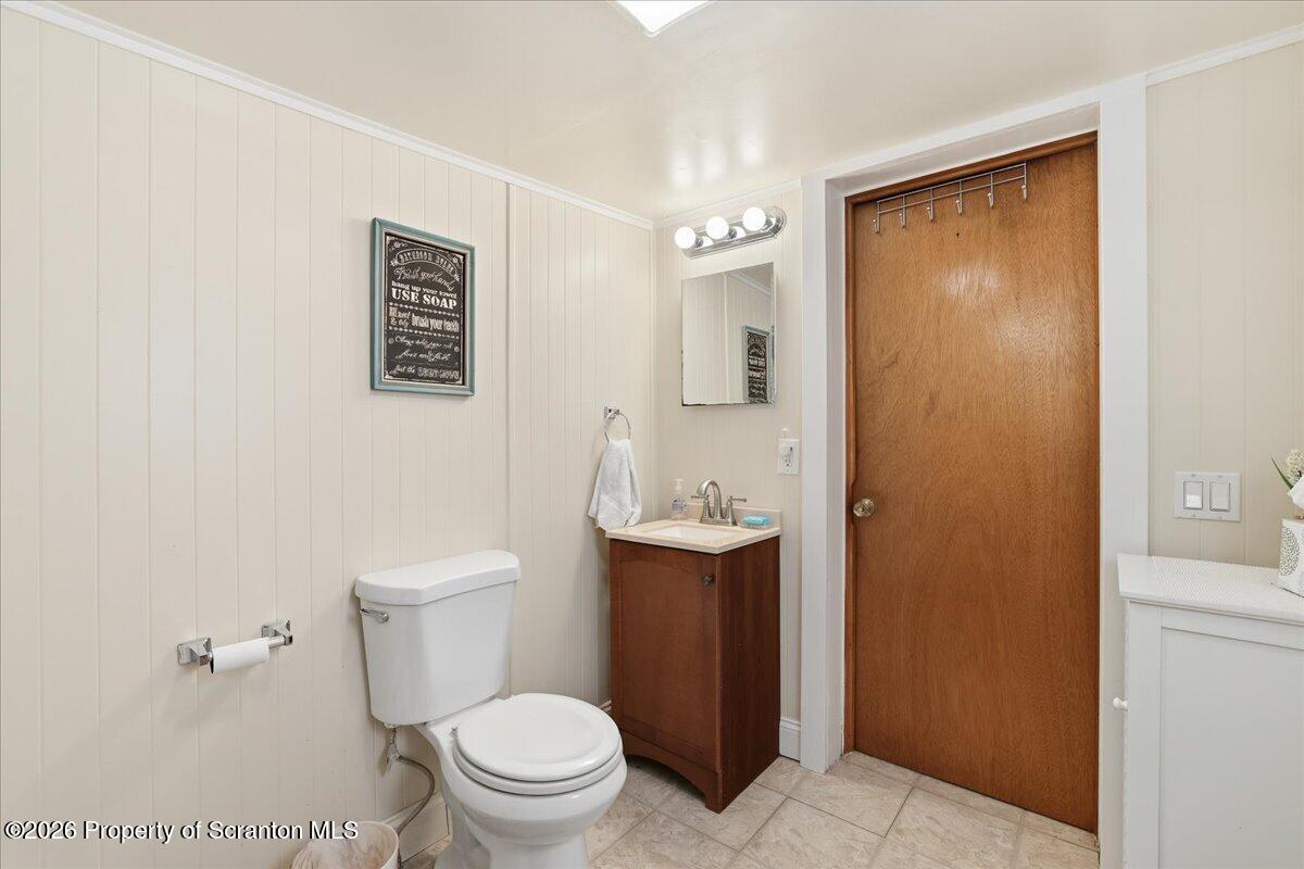 113 Stoney Hill Road Dingmans Ferry, PA 18328 - Photo 34 of 65 a white toilet sitting next to a bathroom sink