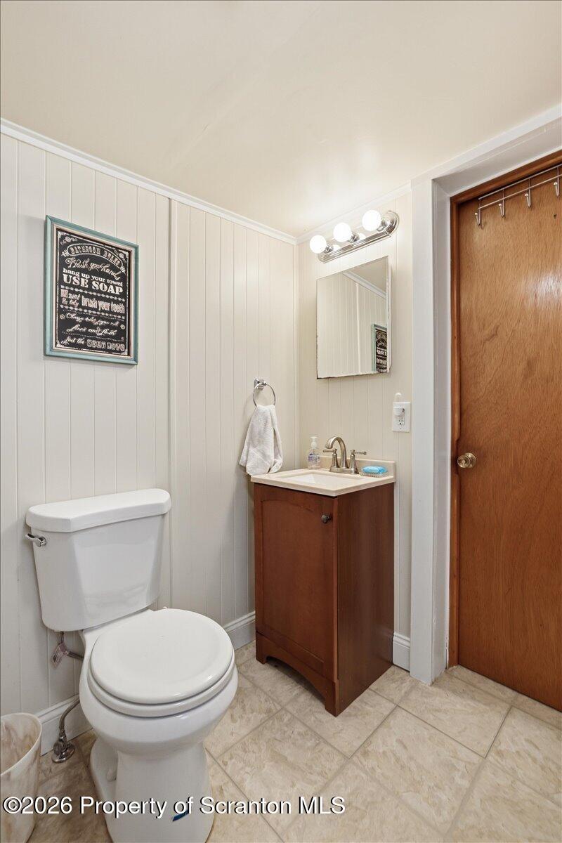 113 Stoney Hill Road Dingmans Ferry, PA 18328 - Photo 36 of 65 a bathroom with a toilet sink and mirror