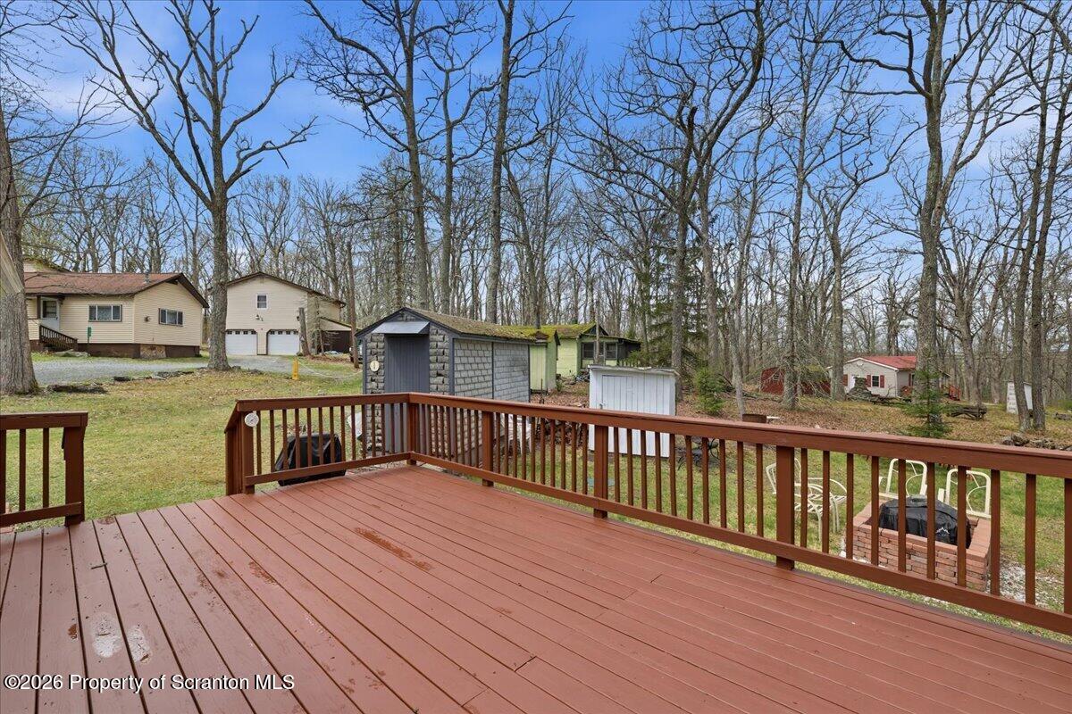 113 Stoney Hill Road Dingmans Ferry, PA 18328 - Photo 39 of 65 a view of street with deck and wooden floor