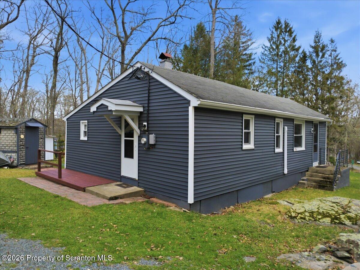 113 Stoney Hill Road Dingmans Ferry, PA 18328 - Photo 4 of 65 a view of a house with a yard