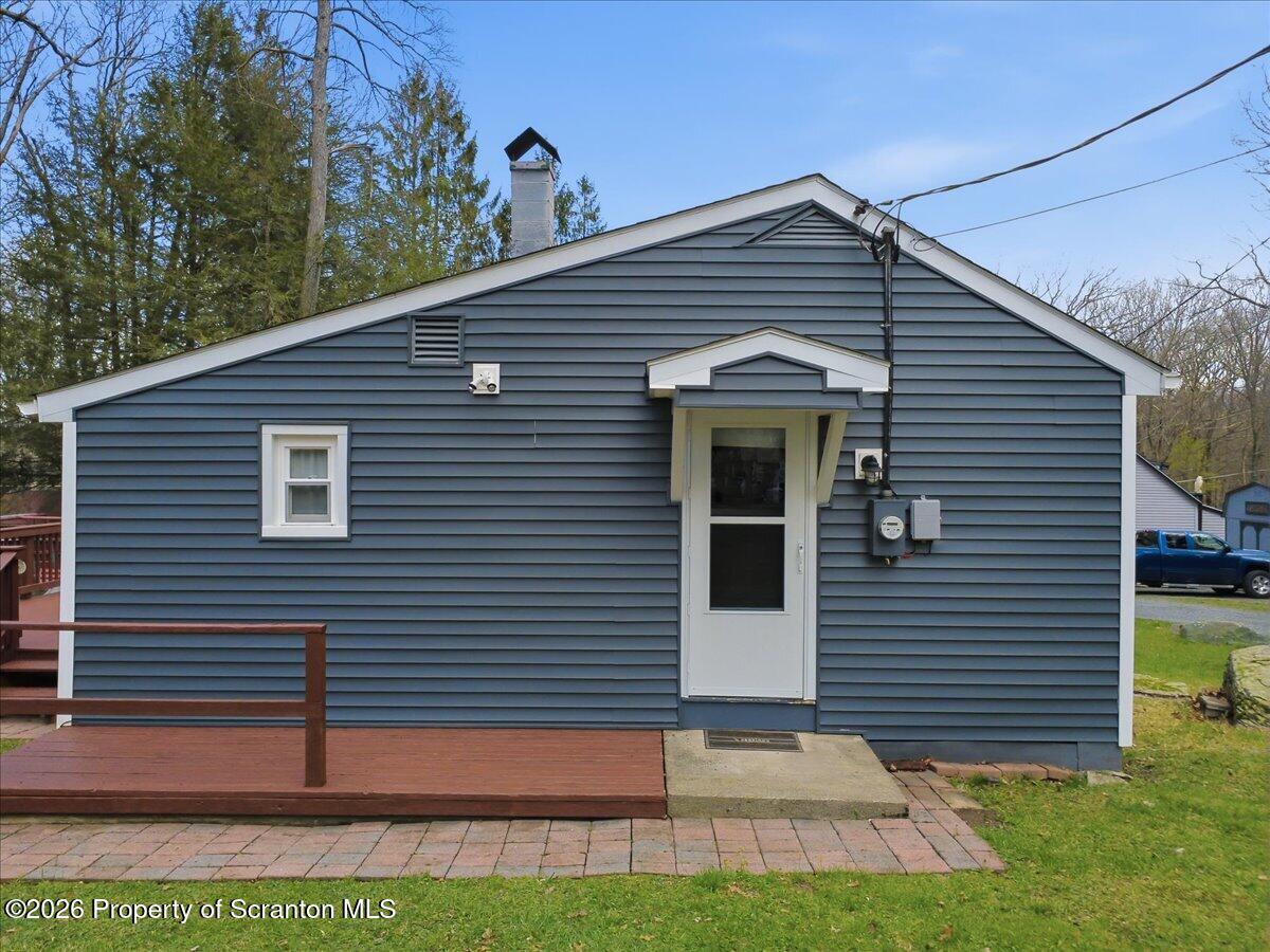 113 Stoney Hill Road Dingmans Ferry, PA 18328 - Photo 46 of 65 a front view of a house with a yard