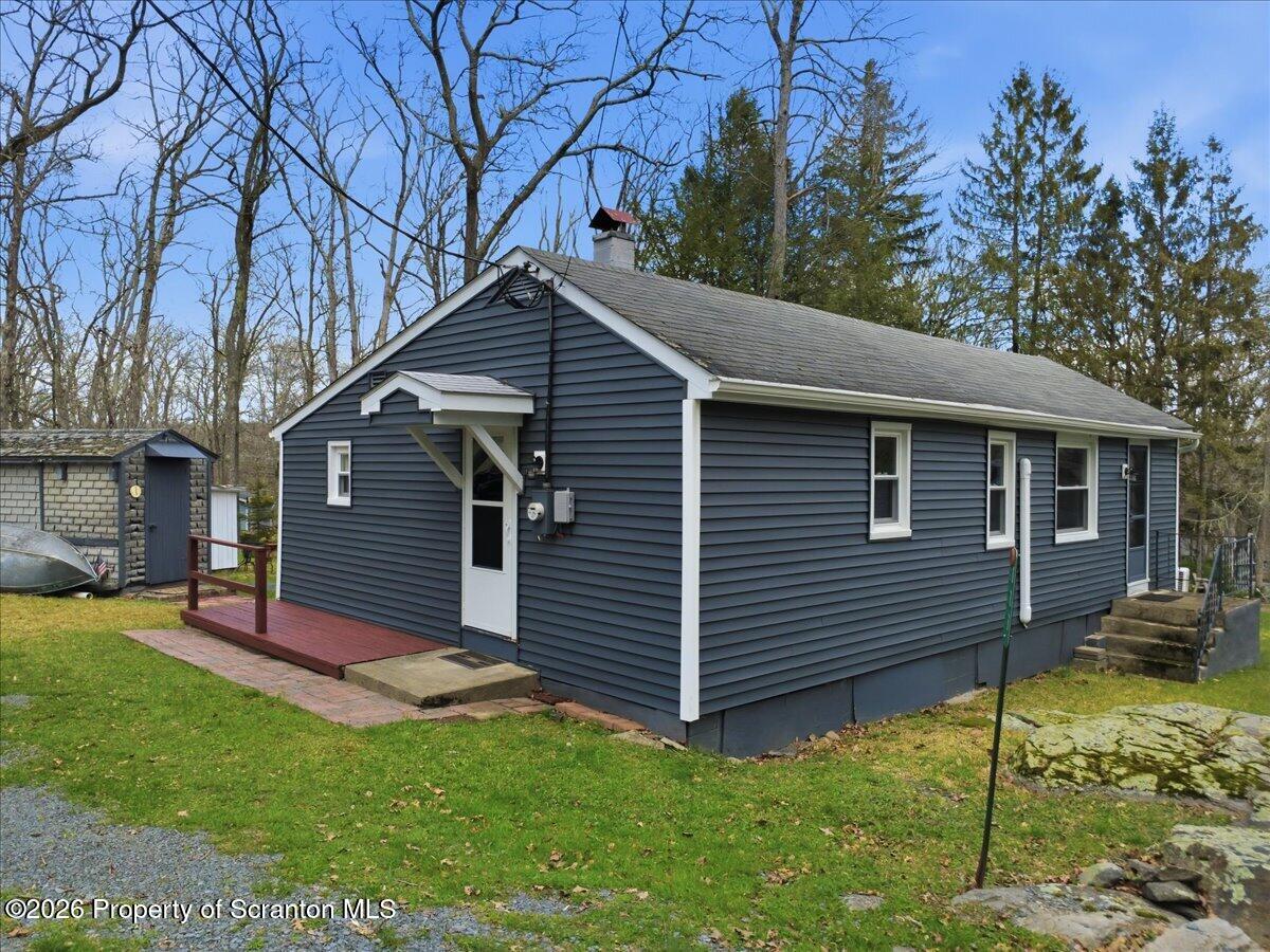 113 Stoney Hill Road Dingmans Ferry, PA 18328 - Photo 5 of 65 a front view of a house with a yard