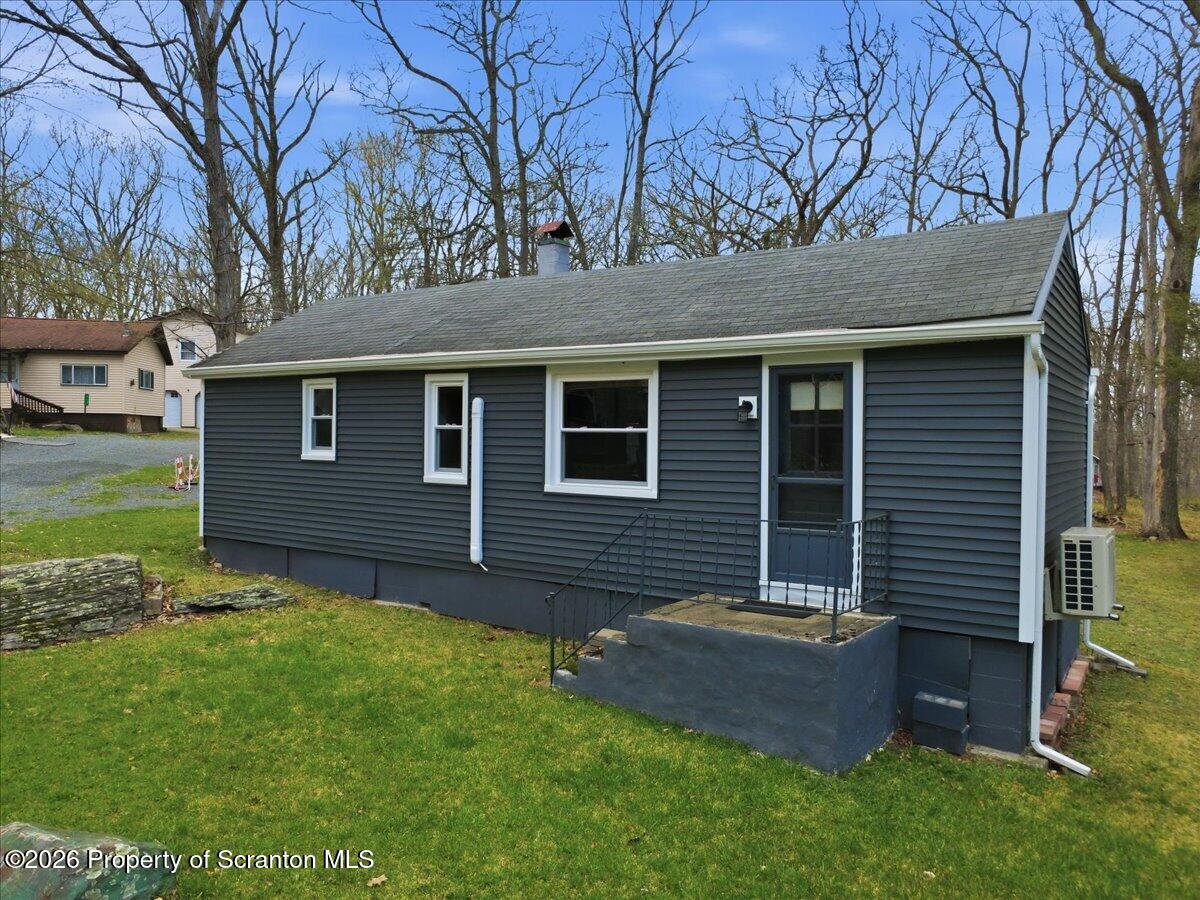 113 Stoney Hill Road Dingmans Ferry, PA 18328 - Photo 7 of 65 a backyard of a house with lots of green space