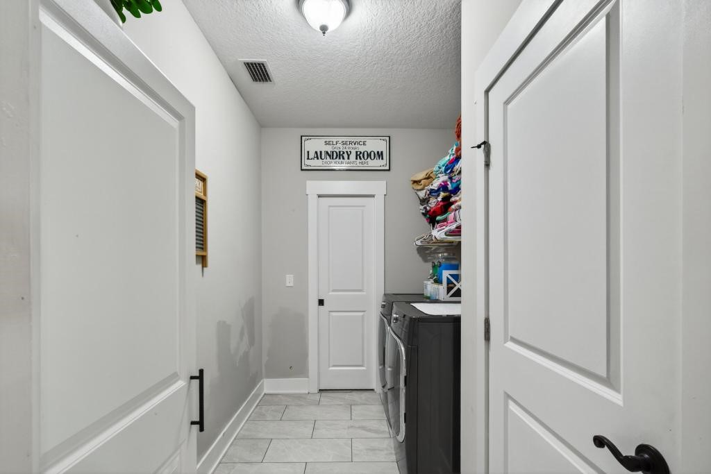75774 Edwards Road Yulee, FL 32097 - Photo 49 of 70 a view of a hallway to room with front door