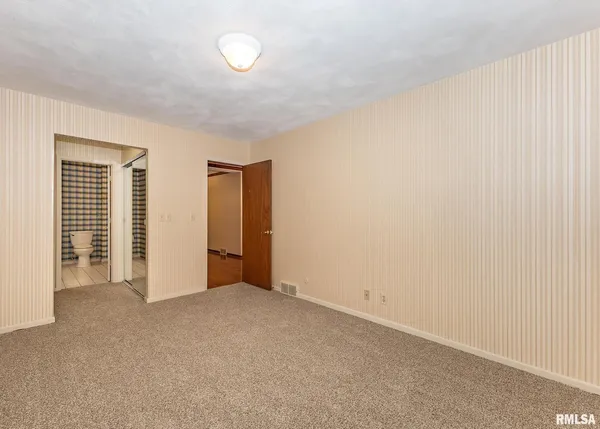 an empty room with closet