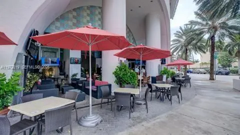 a view of a dinning table and chairs in the patio