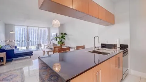 a kitchen with a stove a sink and a refrigerator