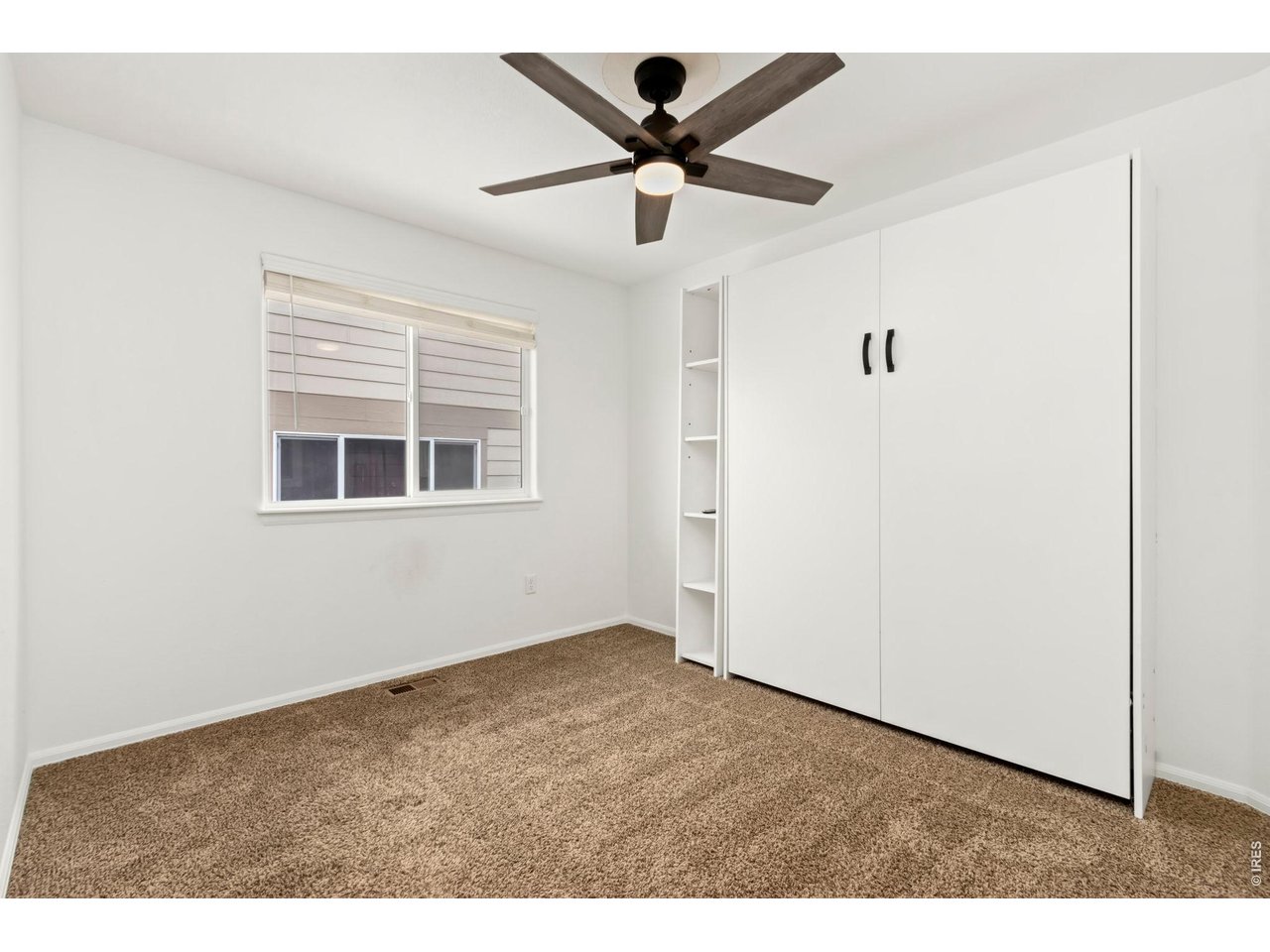1484 First Light Drive Windsor, CO 80550 - Photo 12 of 23 a view of empty room with wooden floor
