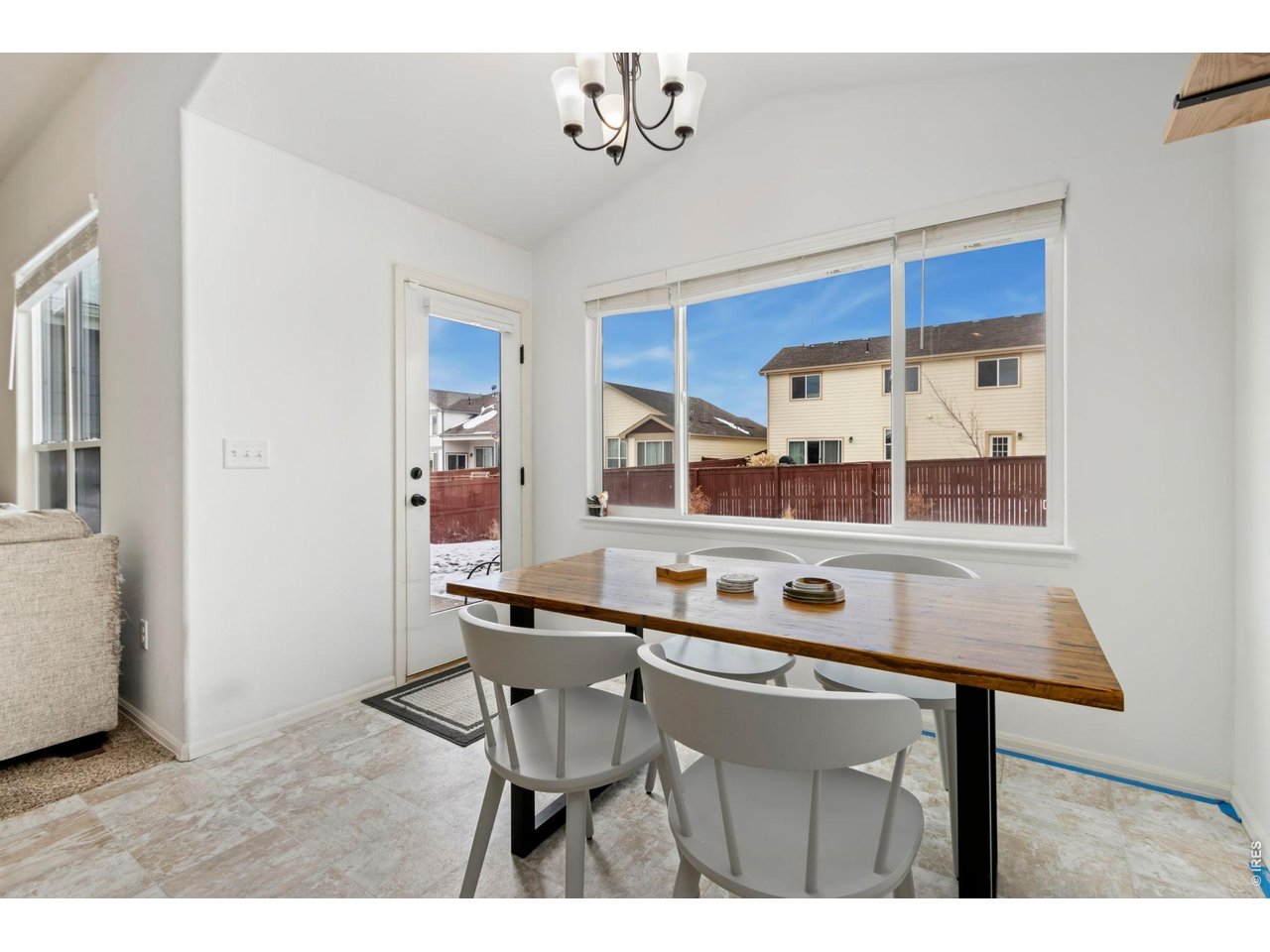 1484 First Light Drive Windsor, CO 80550 - Photo 8 of 23 a dining room with a table and chairs