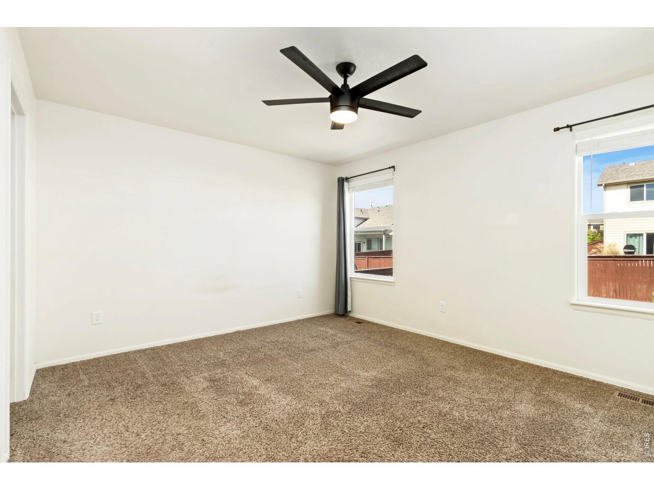 1484 First Light Drive Windsor, CO 80550 - Photo 9 of 23 a view of a ceiling fan and a window in the room