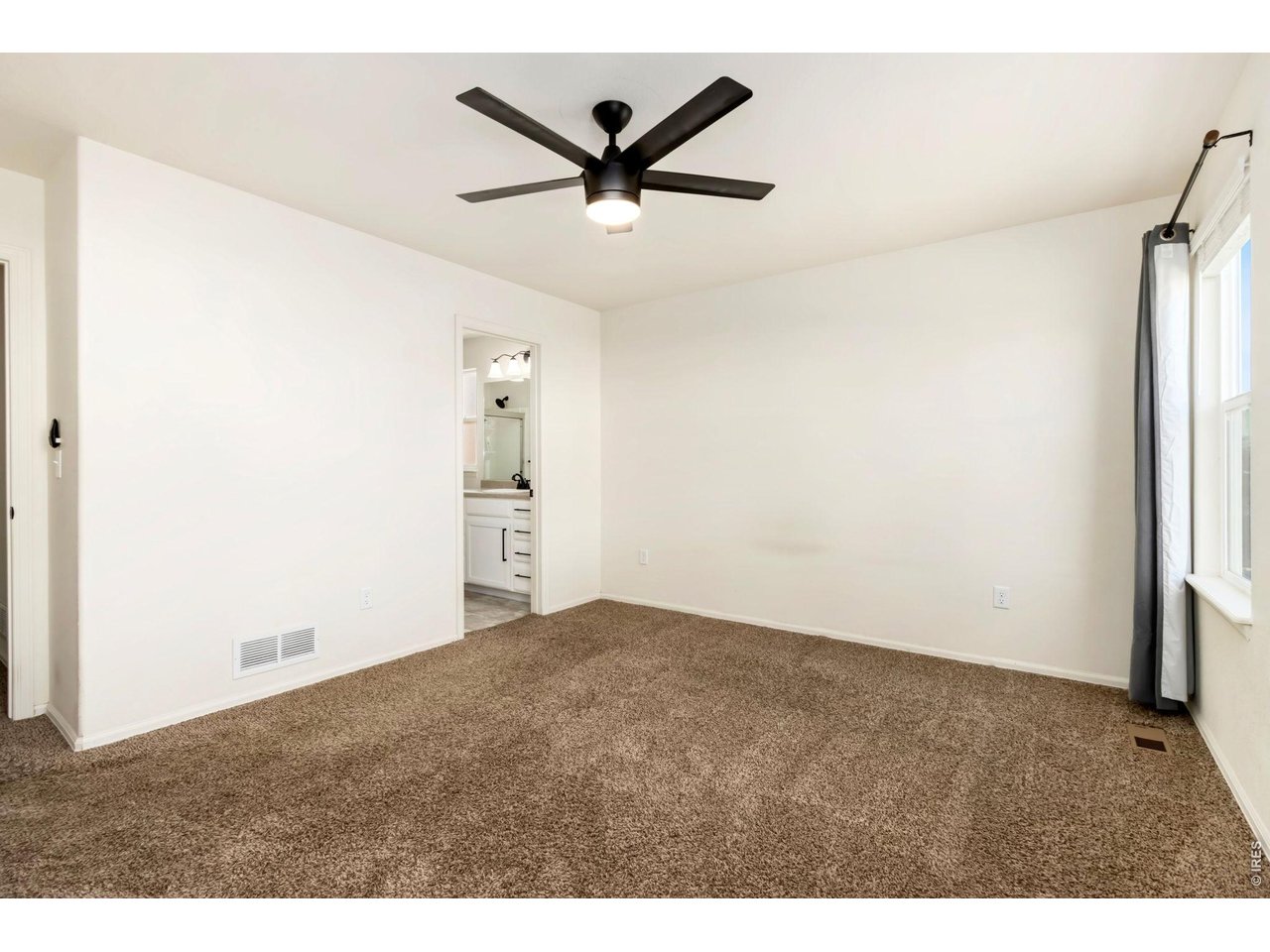 1484 First Light Drive Windsor, CO 80550 - Photo 10 of 23 a view of a livingroom with a ceiling fan and wooden floor
