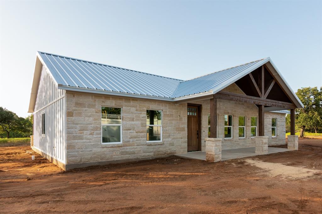 234 Pumphrey Road Loving, TX 76460 - Photo 1 of 1 a front view of a house with garage