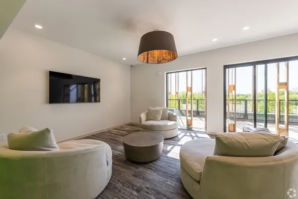 a living room with furniture and a large window