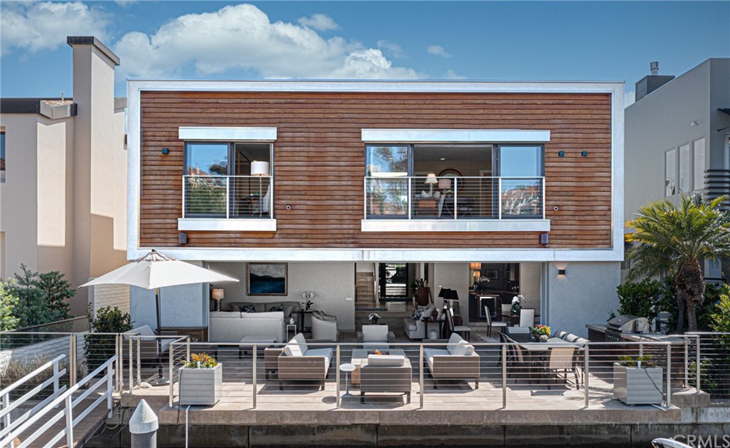 a front view of a house with sitting area